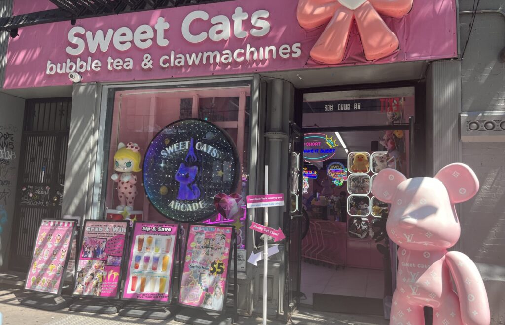 The storefront of Sweet Cats: bubble tea & claw machines.